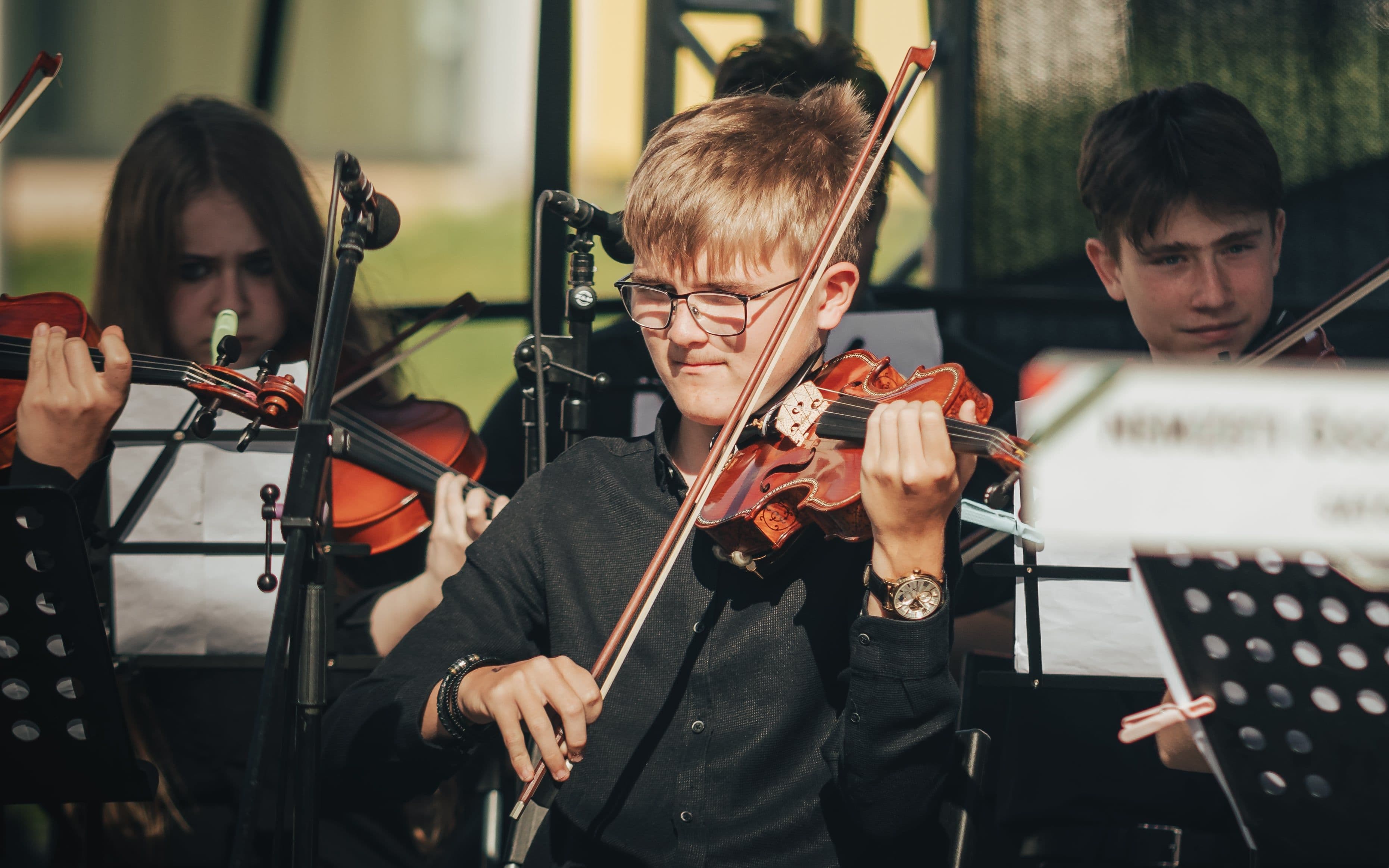 Young violinists performing together in an ensemble